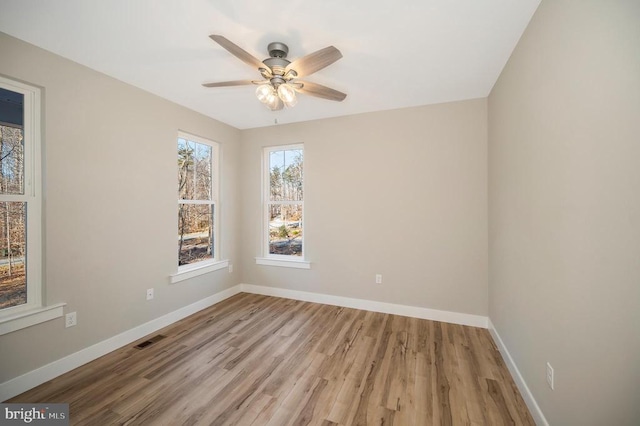 92 Mill Run, Bumpass, VA 23024 - spare room featuring baseboards, visible vents, a ceiling fan, and wood finished floors