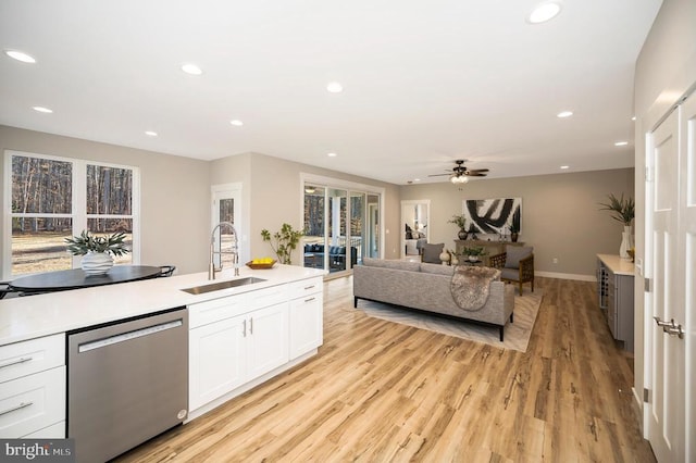 92 Mill Run, Bumpass, VA 23024 - kitchen featuring recessed lighting, dishwasher, light wood finished floors, a sink, and white cabinetry