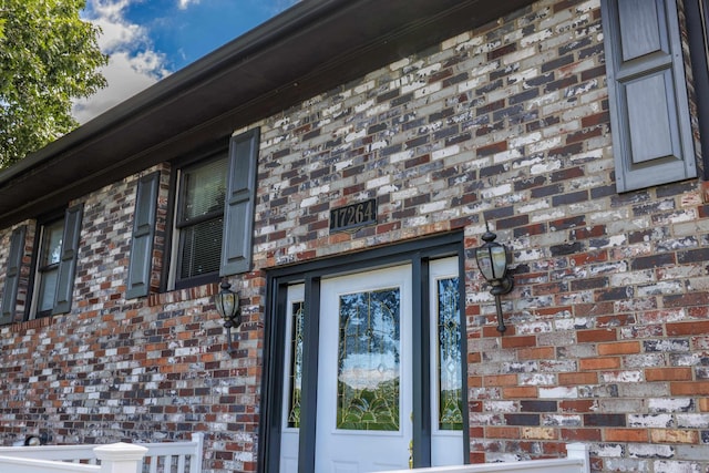 exterior space with brick siding