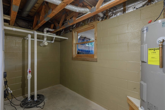 unfinished basement featuring water heater and concrete block wall