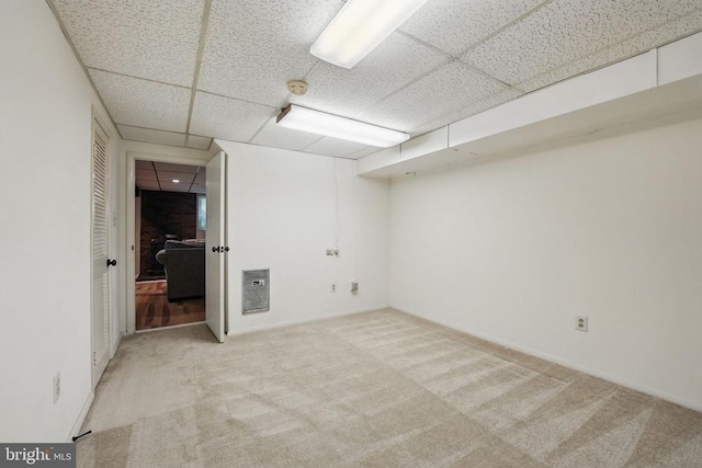  - finished basement featuring a drop ceiling and carpet flooring