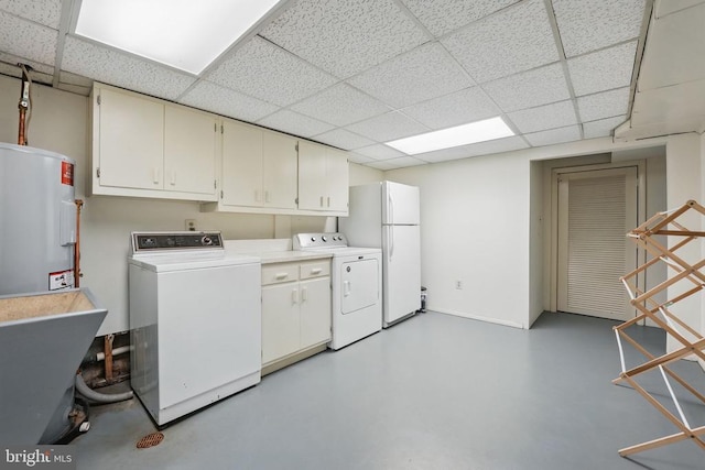  - washroom with water heater, separate washer and dryer, and cabinet space