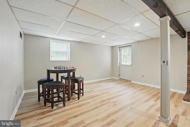  - dining room featuring wood finished floors, healthy amount of natural light, a drop ceiling, baseboards, and recessed lighting