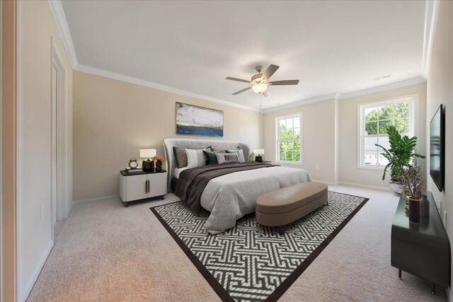 carpeted bedroom with baseboards, ornamental molding, and a ceiling fan
