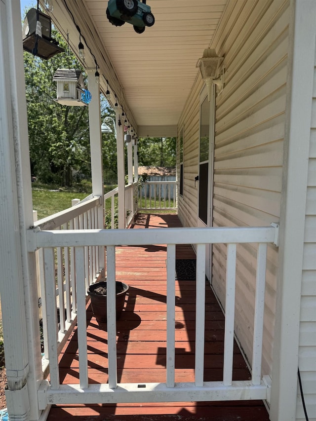 wooden terrace with a porch