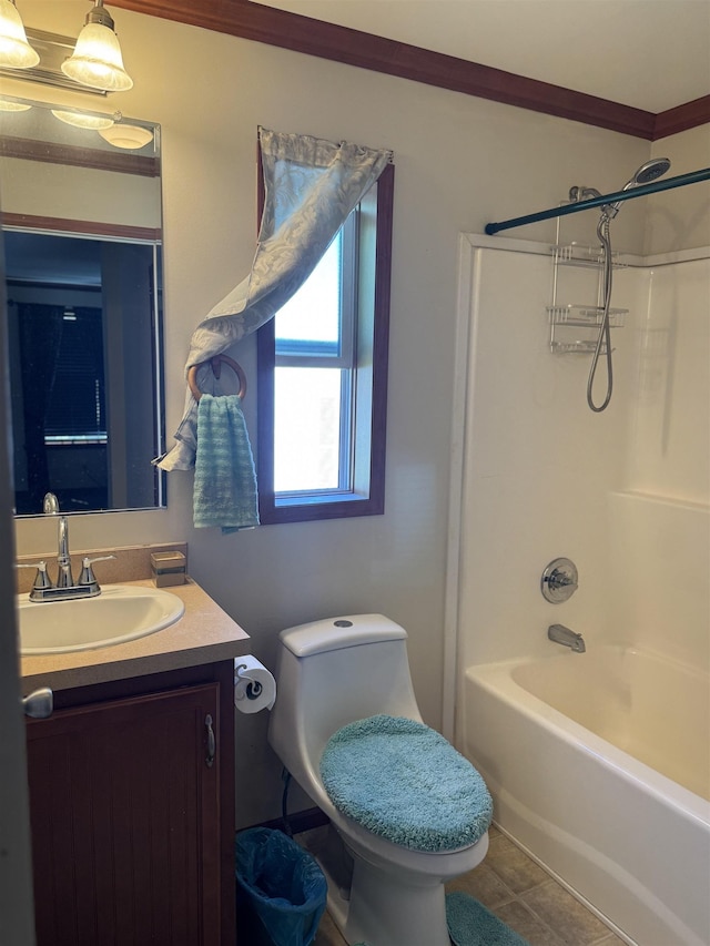 bathroom with toilet, vanity, and shower / washtub combination