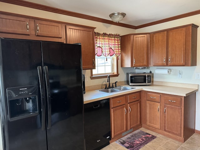 kitchen featuring black appliances, a sink, brown cabinets, light countertops, and ornamental molding
