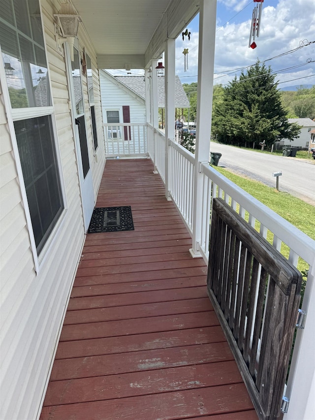 wooden terrace featuring a porch