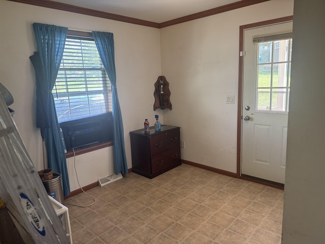 doorway featuring ornamental molding, baseboards, and cooling unit