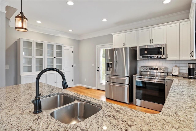115 Beauregard Dr, Staunton, VA 24401 - kitchen featuring stainless steel appliances, a sink, light wood-style floors, light stone counters, and white cabinets