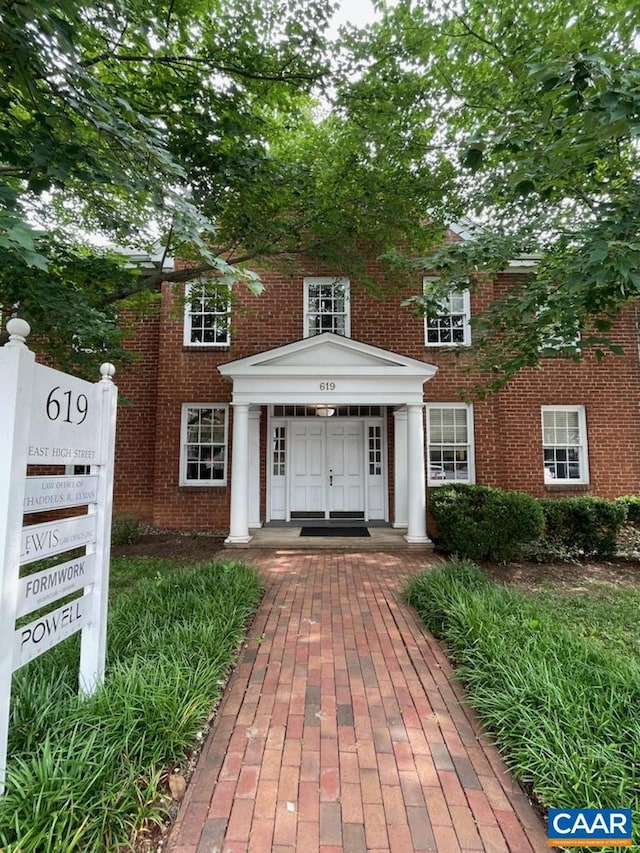 exterior space featuring brick siding