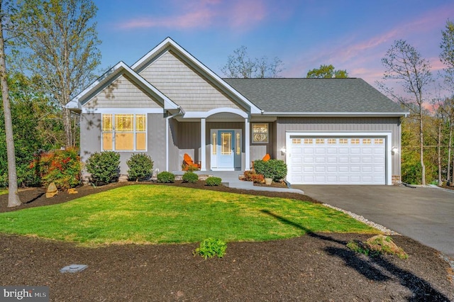 106 Wakefield Dr, Locust Grove, VA 22508 - view of front of house with driveway, a garage, and a lawn