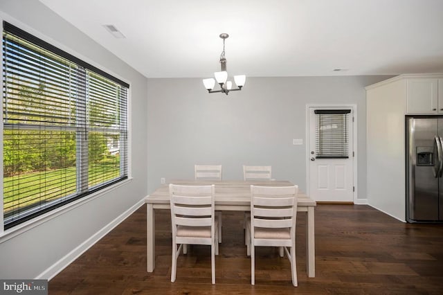106 Wakefield Dr, Locust Grove, VA 22508 - dining area with a chandelier, dark wood finished floors, and baseboards