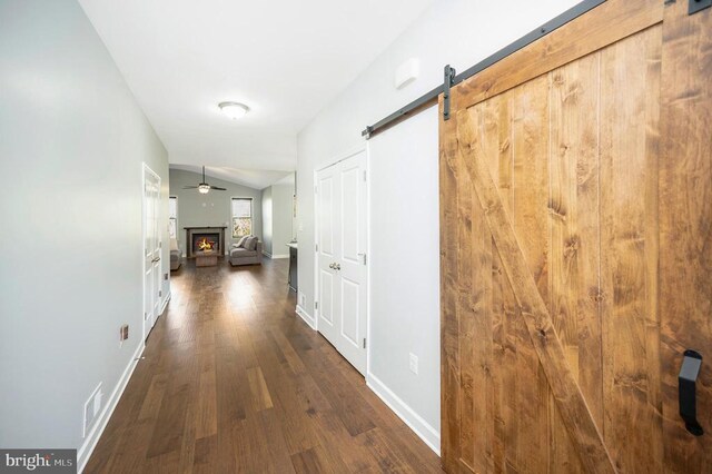 106 Wakefield Dr, Locust Grove, VA 22508 - hall featuring dark wood finished floors, baseboards, lofted ceiling, and a barn door