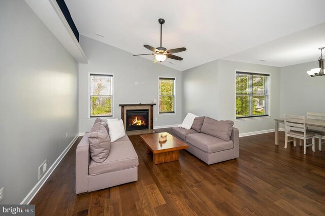 106 Wakefield Dr, Locust Grove, VA 22508 - living area featuring wood finished floors, vaulted ceiling, baseboards, a premium fireplace, and a chandelier