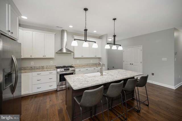 106 Wakefield Dr, Locust Grove, VA 22508 - kitchen with stainless steel appliances, wall chimney range hood, a sink, dark wood-style flooring, and recessed lighting