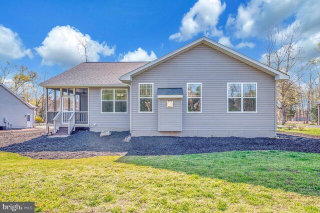 106 Wakefield Dr, Locust Grove, VA 22508 - back of property with a lawn and a sunroom