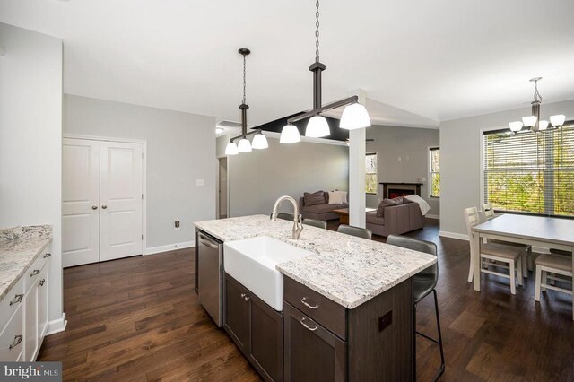 106 Wakefield Dr, Locust Grove, VA 22508 - kitchen with a sink, a chandelier, dishwasher, dark brown cabinets, and a breakfast bar area