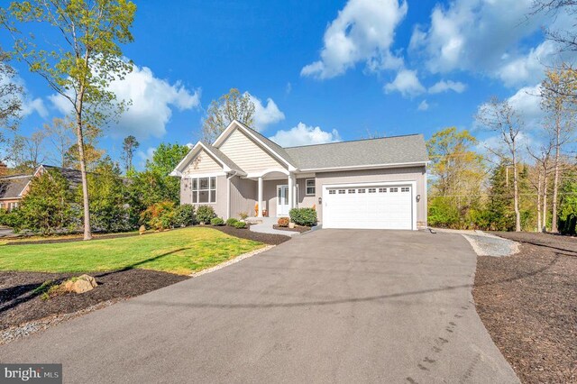 106 Wakefield Dr, Locust Grove, VA 22508 - view of front of home with driveway, a garage, a front lawn, and stucco siding