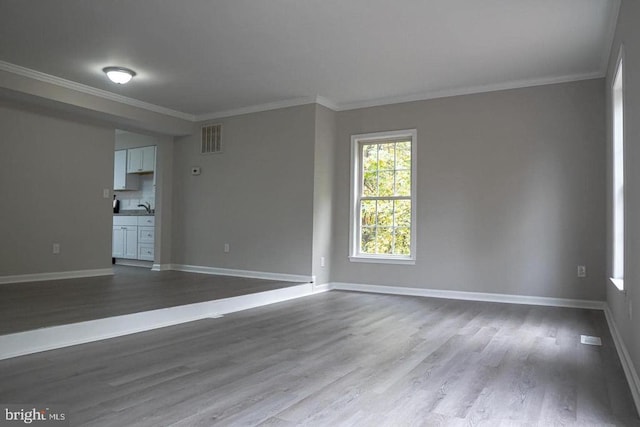 10732 Wakeman Dr, Fredericksburg, VA 22407 - unfurnished living room with wood finished floors and ornamental molding