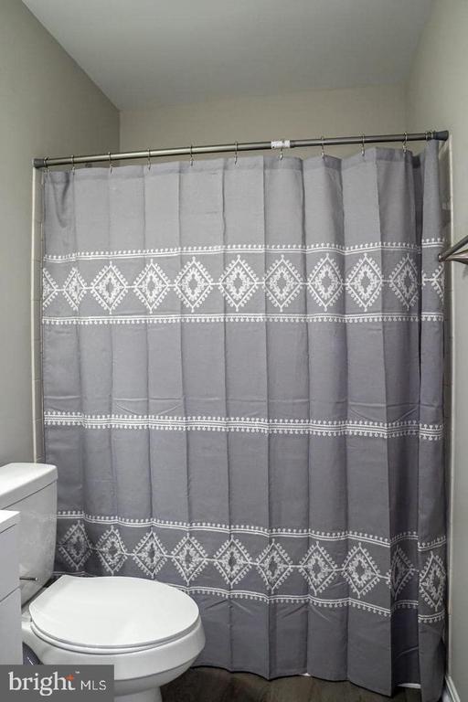10732 Wakeman Dr, Fredericksburg, VA 22407 - bathroom with a shower with shower curtain