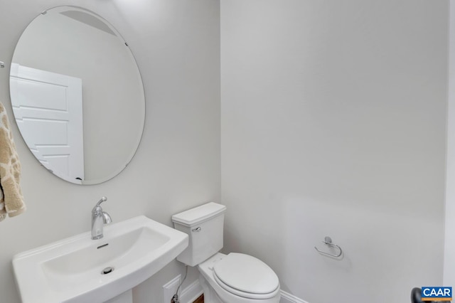 240 Thicket Run Dr, Charlottesville, VA 22911 - bathroom featuring a sink, toilet, and baseboards