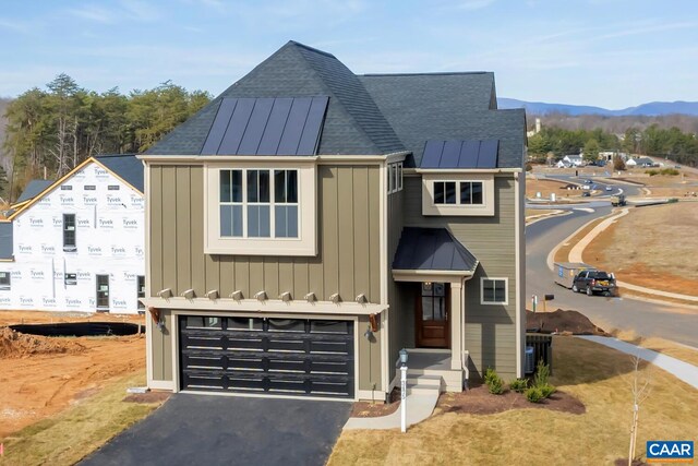 240 Thicket Run Dr, Charlottesville, VA 22911 - view of front of home featuring a shingled roof, metal roof, a garage, and a standing seam roof