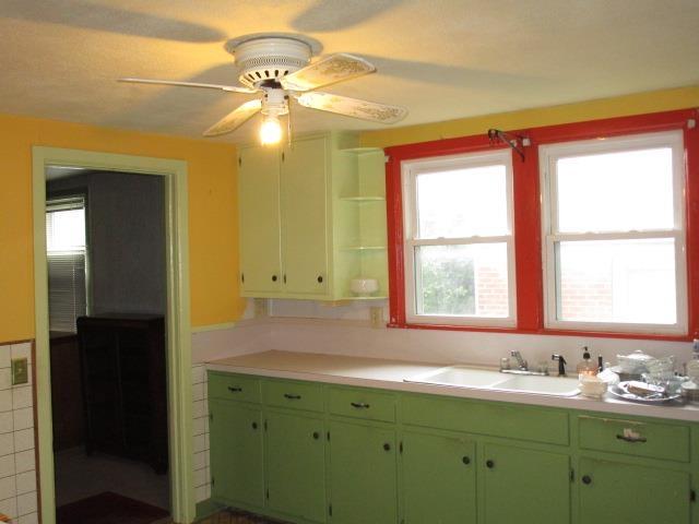 106 Grubert Ave, Staunton, VA 24401 - kitchen with a sink, open shelves, light countertops, a ceiling fan, and green cabinetry