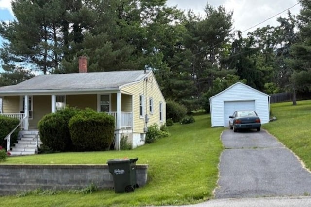 106 Grubert Ave, Staunton, VA 24401 - view of front facade featuring asphalt driveway, an outdoor structure, a garage, a chimney, and a porch