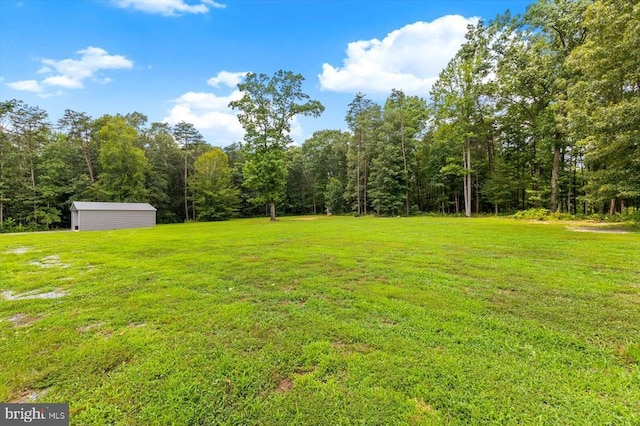 7922 Madison Plantation Way, Fredericksburg, VA 22407 - view of grassy yard with a shed and a wooded view