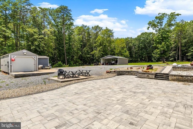 7922 Madison Plantation Way, Fredericksburg, VA 22407 - view of patio / terrace featuring an outbuilding and a forest view