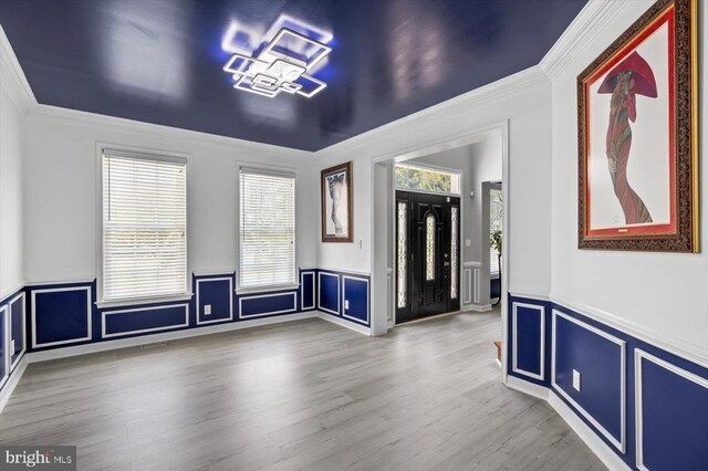 7922 Madison Plantation Way, Fredericksburg, VA 22407 - empty room with crown molding, a wainscoted wall, a decorative wall, and wood finished floors
