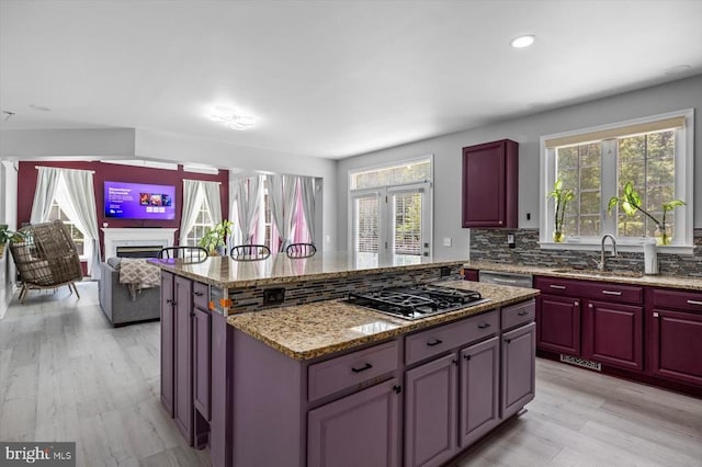 7922 Madison Plantation Way, Fredericksburg, VA 22407 - kitchen with stainless steel appliances, plenty of natural light, dark brown cabinets, a kitchen island, and recessed lighting