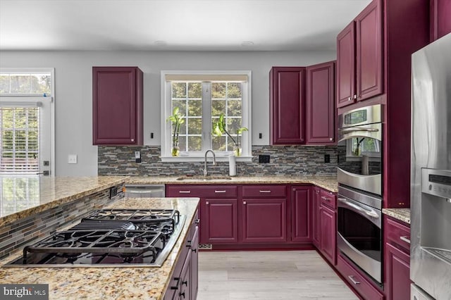 7922 Madison Plantation Way, Fredericksburg, VA 22407 - kitchen featuring appliances with stainless steel finishes, reddish brown cabinets, and tasteful backsplash