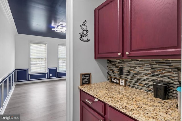 7922 Madison Plantation Way, Fredericksburg, VA 22407 - kitchen featuring ornamental molding, backsplash, light stone countertops, wood finished floors, and dark brown cabinets