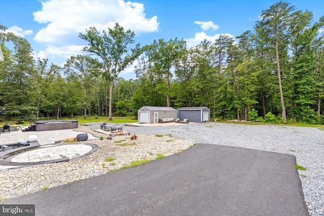 7922 Madison Plantation Way, Fredericksburg, VA 22407 - view of yard featuring a hot tub, a shed, a patio area, and a forest view