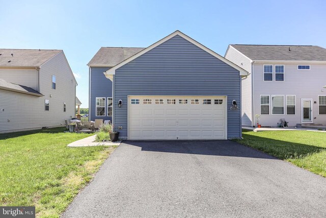 1906 Captain Dr, Fredericksburg, VA 22408 - view of front of house featuring asphalt driveway, a front yard, and an attached garage