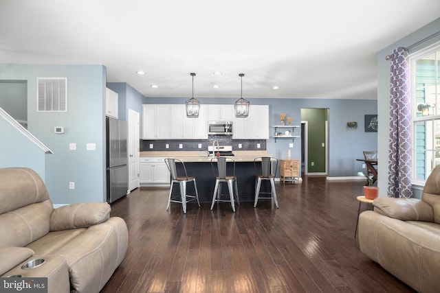 1906 Captain Dr, Fredericksburg, VA 22408 - living room with recessed lighting, dark wood finished floors, and baseboards