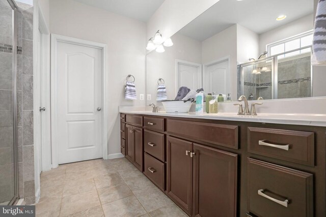 1906 Captain Dr, Fredericksburg, VA 22408 - full bathroom with a tile shower, double vanity, and tile patterned floors