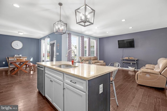 1906 Captain Dr, Fredericksburg, VA 22408 - kitchen featuring a sink, open floor plan, an accent wall, dishwasher, and white cabinets