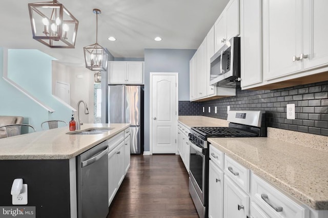 1906 Captain Dr, Fredericksburg, VA 22408 - kitchen with appliances with stainless steel finishes, a sink, decorative backsplash, dark wood-style flooring, and recessed lighting