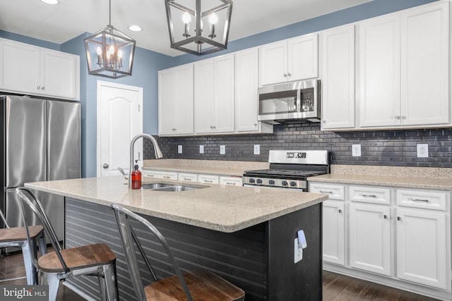 1906 Captain Dr, Fredericksburg, VA 22408 - kitchen featuring stainless steel appliances, a sink, a chandelier, decorative backsplash, and recessed lighting