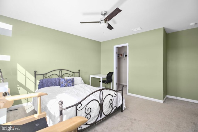 1906 Captain Dr, Fredericksburg, VA 22408 - bedroom featuring carpet floors, baseboards, a walk in closet, a closet, and ceiling fan