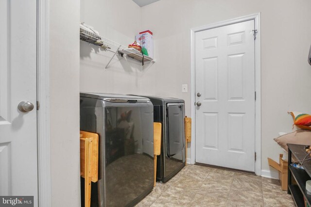 1906 Captain Dr, Fredericksburg, VA 22408 - laundry area featuring washing machine and clothes dryer and baseboards