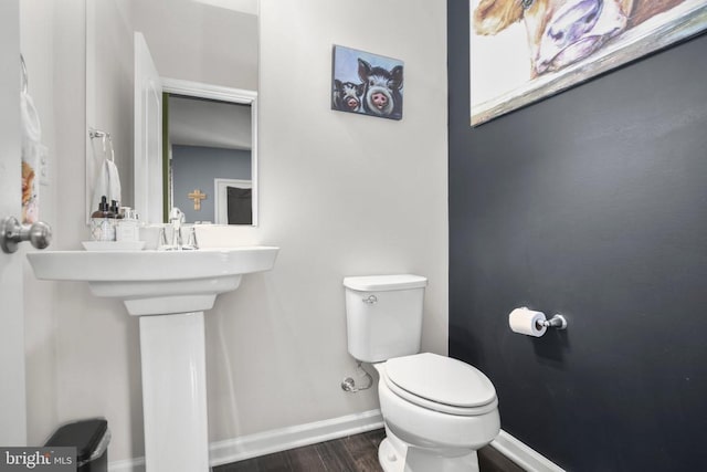 1906 Captain Dr, Fredericksburg, VA 22408 - bathroom featuring wood finished floors, baseboards, toilet, and a sink