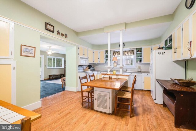 403 Long Ave, Shenandoah, VA 22849 - dining space with light wood-style floors, ceiling fan, and baseboards