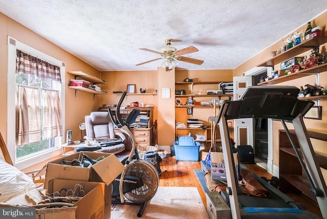 403 Long Ave, Shenandoah, VA 22849 - workout area featuring wood finished floors, a ceiling fan, and a textured ceiling