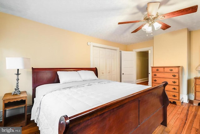 403 Long Ave, Shenandoah, VA 22849 - bedroom with wood finished floors, a closet, a ceiling fan, and baseboards