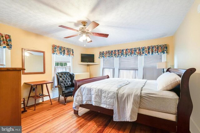 403 Long Ave, Shenandoah, VA 22849 - bedroom with hardwood / wood-style flooring, baseboards, and a ceiling fan