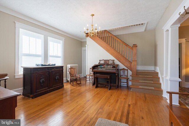403 Long Ave, Shenandoah, VA 22849 - entryway with stairs, light wood finished floors, a chandelier, radiator heating unit, and baseboards